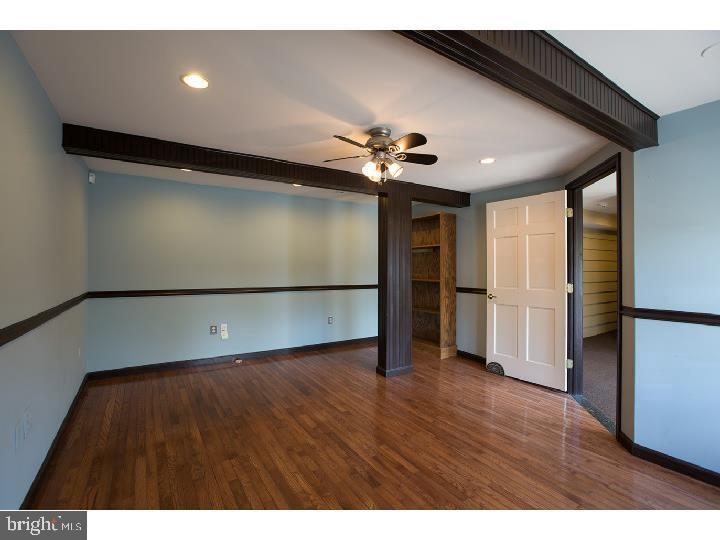 35 Beulah Road Doylestown, PA 18901 - Photo 20 of 41 a view of an empty room with wooden floor