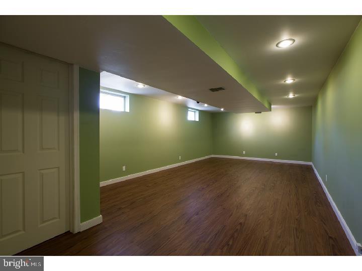 35 Beulah Road Doylestown, PA 18901 - Photo 21 of 41 a view of an empty room with wooden floor