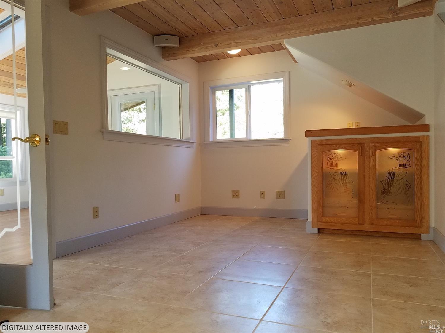 44005 Iversen Road Gualala, CA 95445 - Photo 8 of 18 Family room- picture taken prior to tenant moving in.