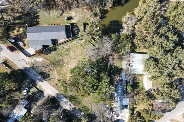 an aerial view of residential house with outdoor space