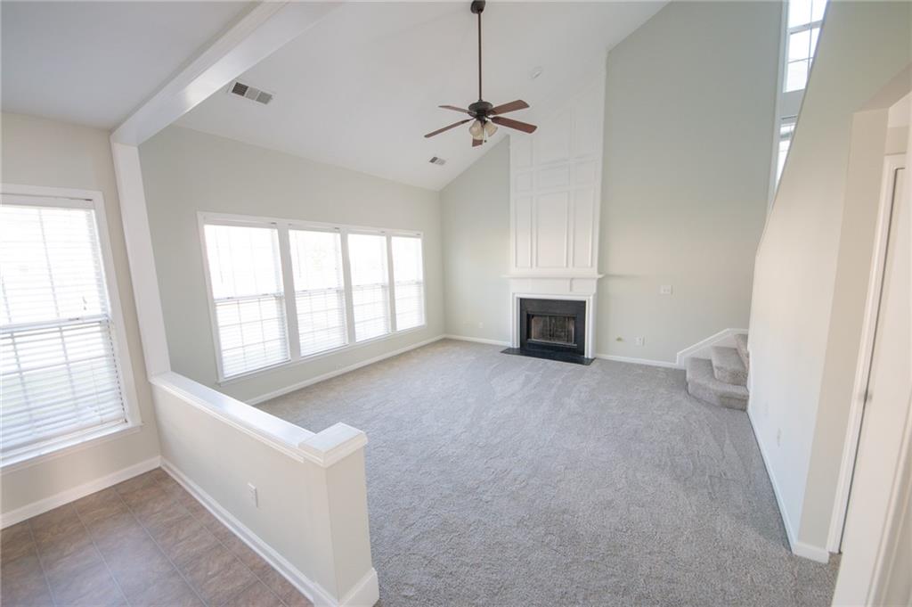 8145 Lockslay Way Suwanee, GA 30024 - Photo 3 of 18 a view of an empty room with a window