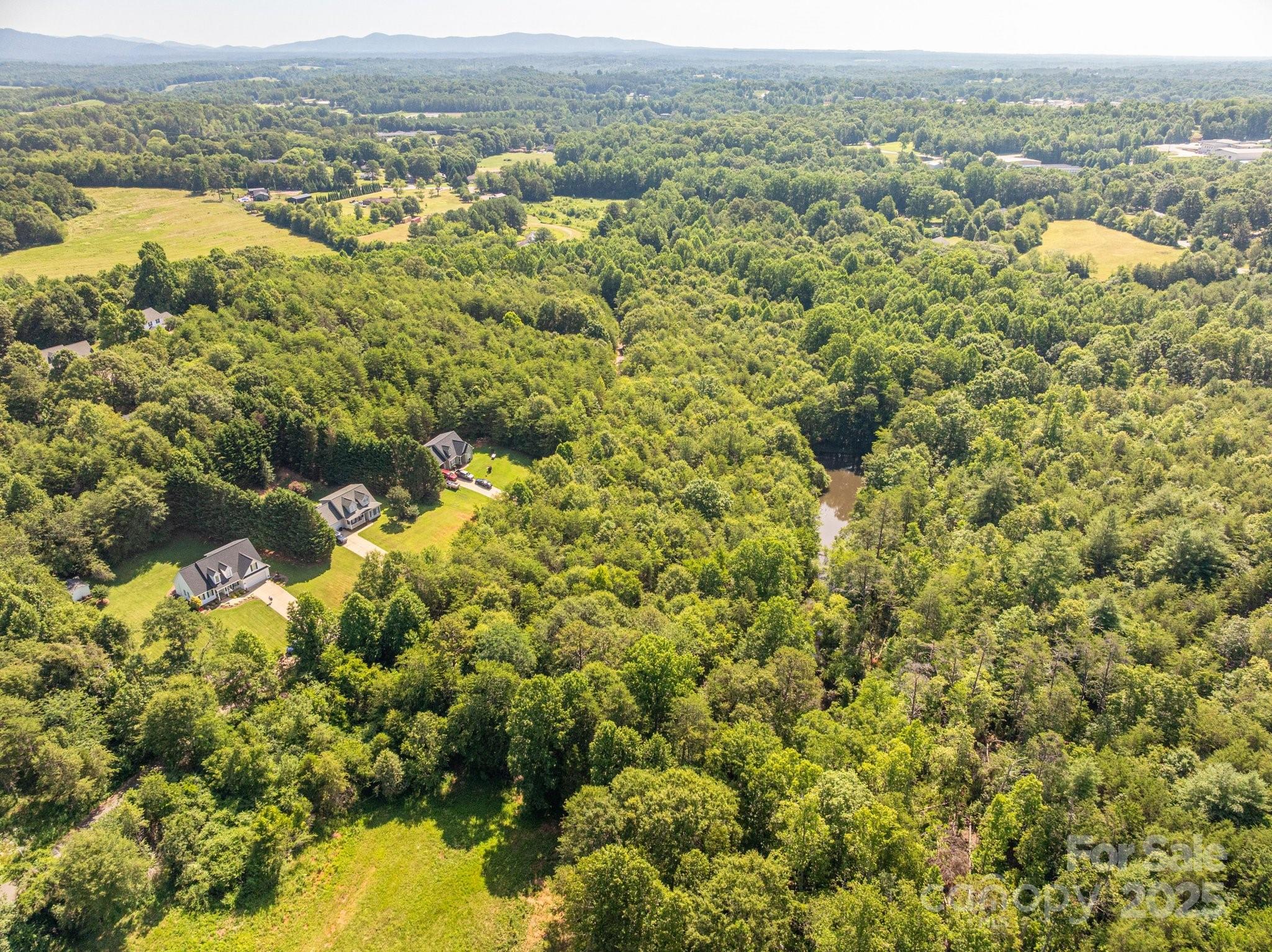 Lot 7 Meadow Crossing Drive Rutherfordton, NC 28139 - Photo 6 of 15 an aerial view of a houses with a lake