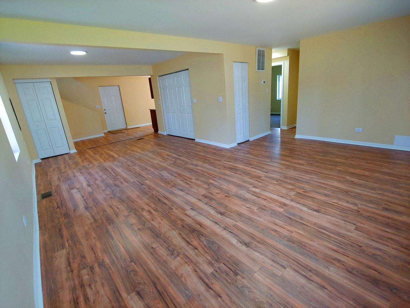 120 Edison Road Joliet, IL 60433 - Photo 3 of 21 a view of an empty room with wooden floor