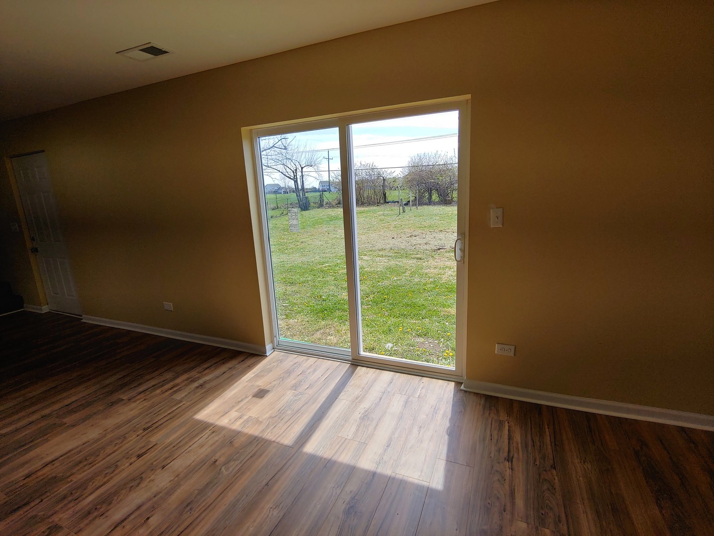 120 Edison Road Joliet, IL 60433 - Photo 8 of 21 a view of an empty room and glass door