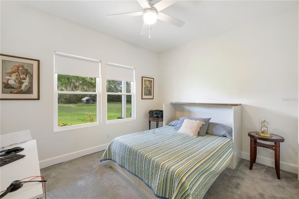 5149 Southwest 119th Road Lake Butler, FL 32054 - Photo 27 of 40 a bedroom with a bed and a window