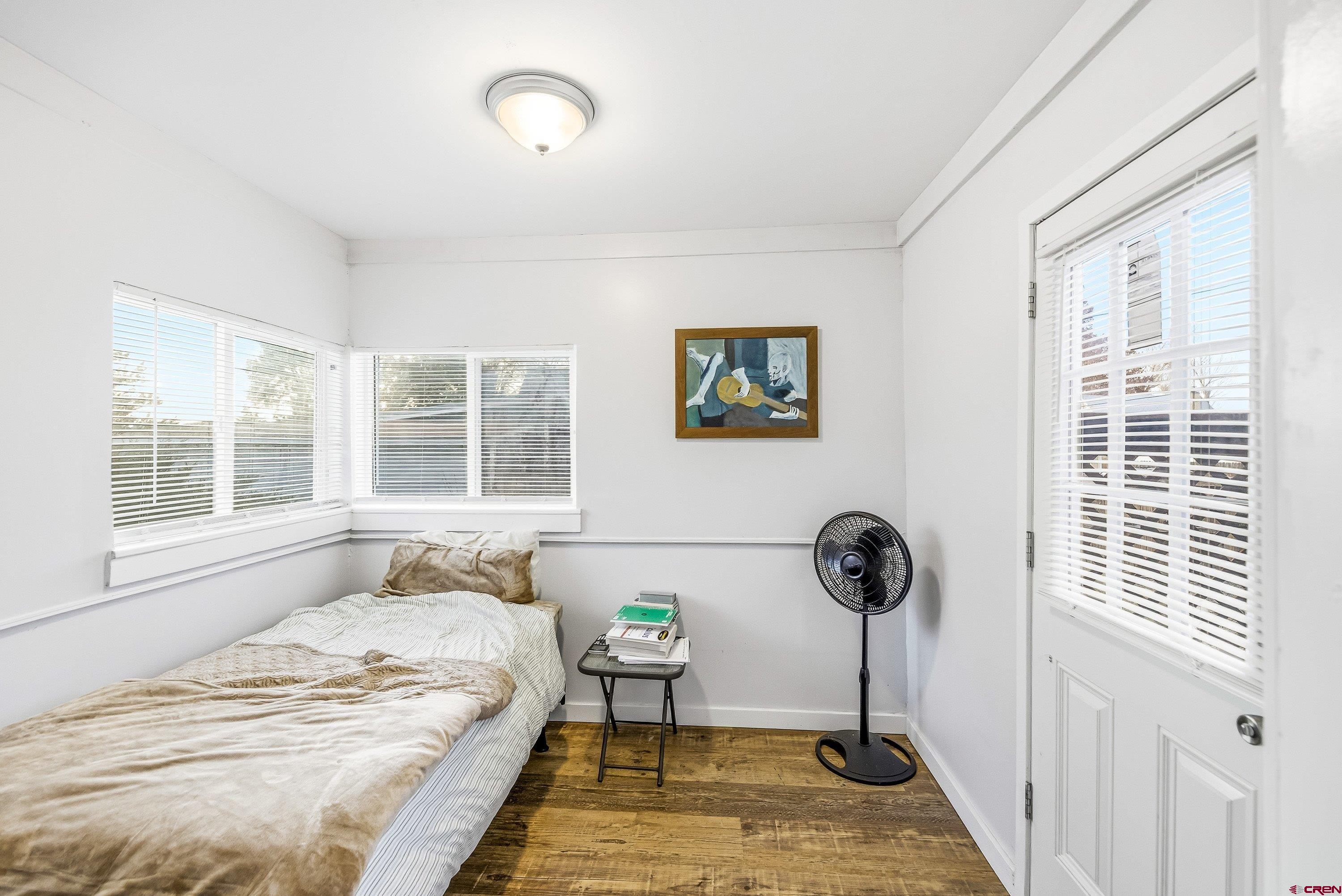 249 Park Street Delta, CO 81416 - Photo 12 of 22 a bedroom with a bed and a window