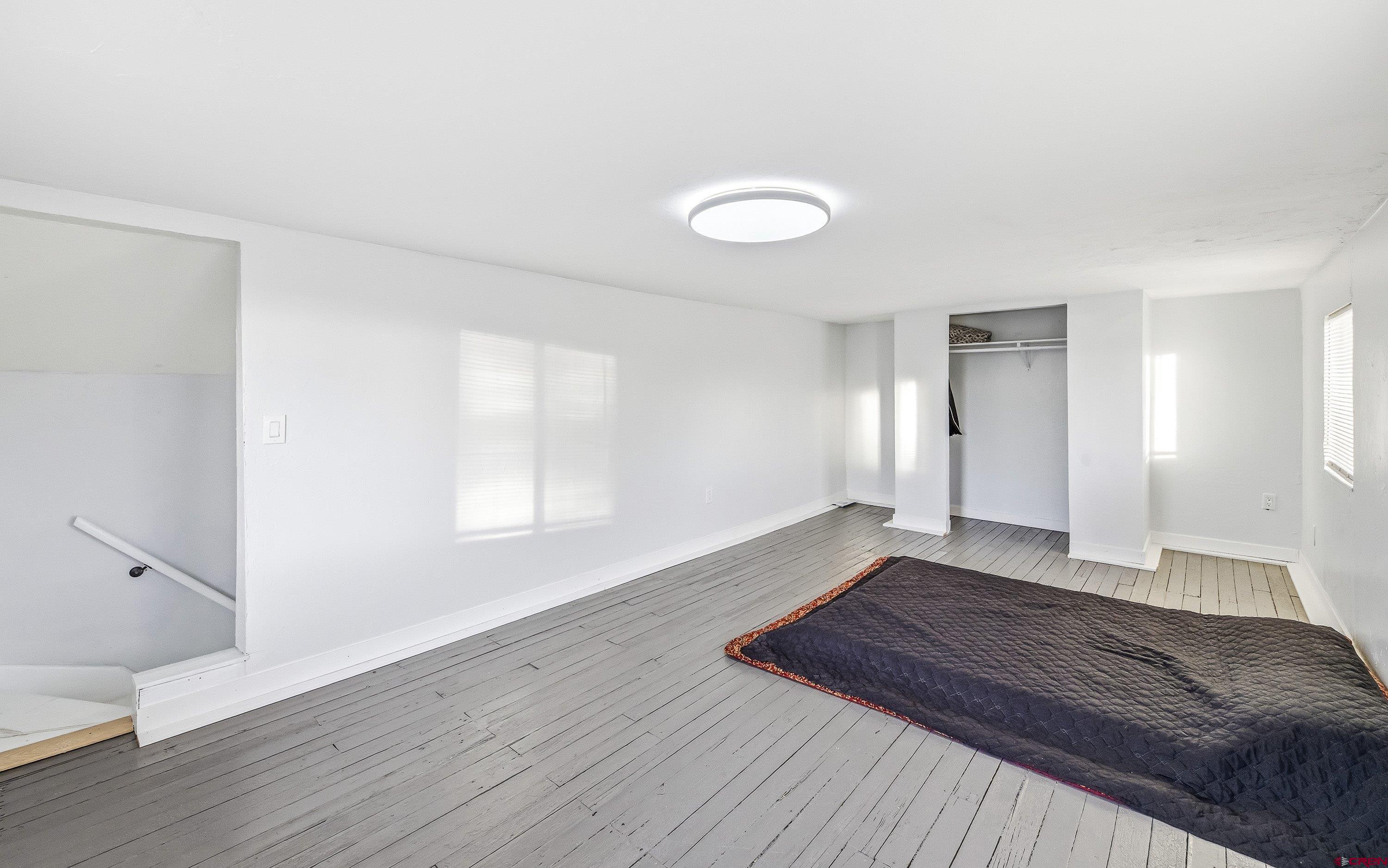 249 Park Street Delta, CO 81416 - Photo 17 of 22 a view of a room with wooden floor and window