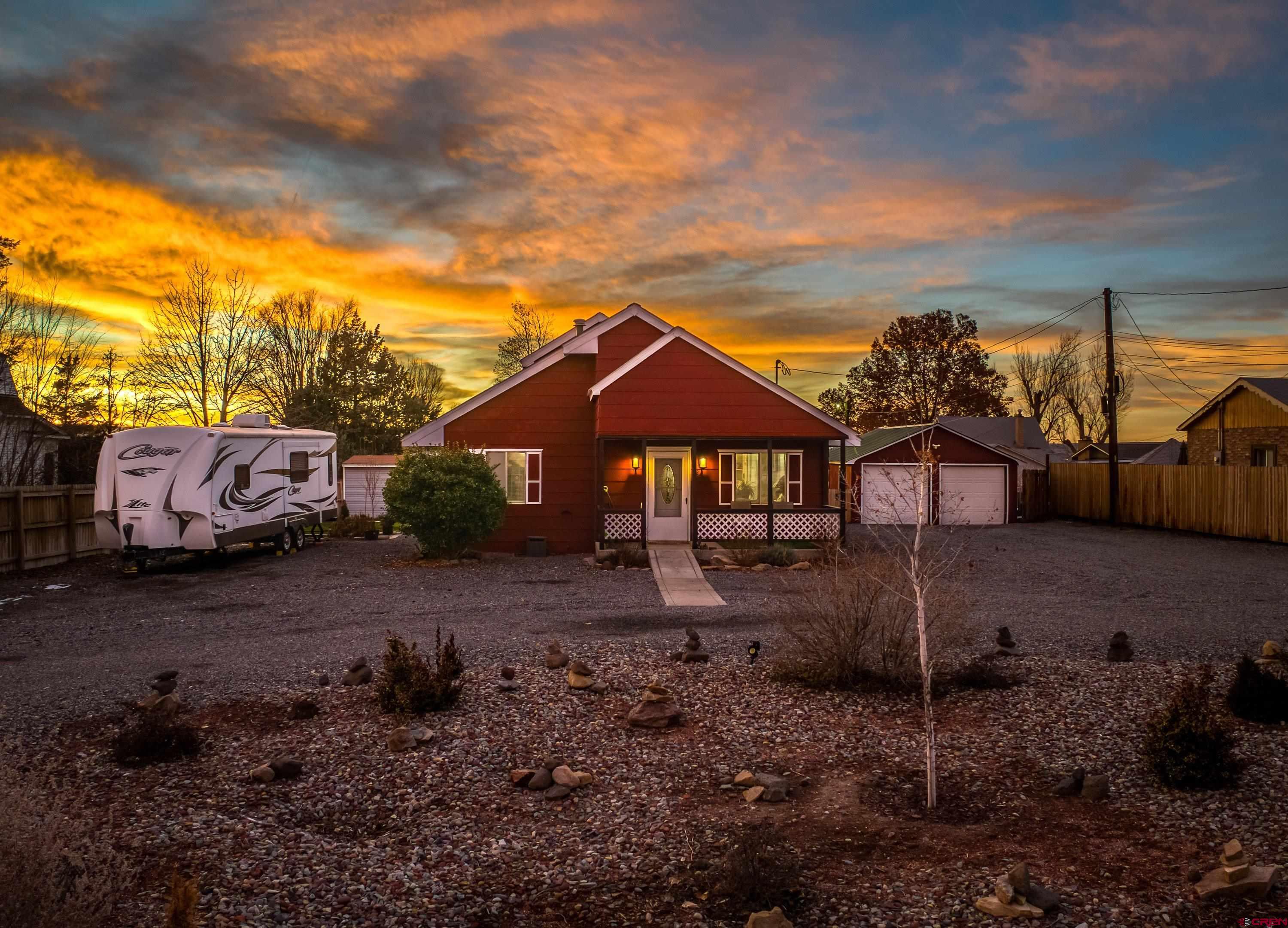 249 Park Street Delta, CO 81416 - Photo 18 of 22 a front view of a house with a yard