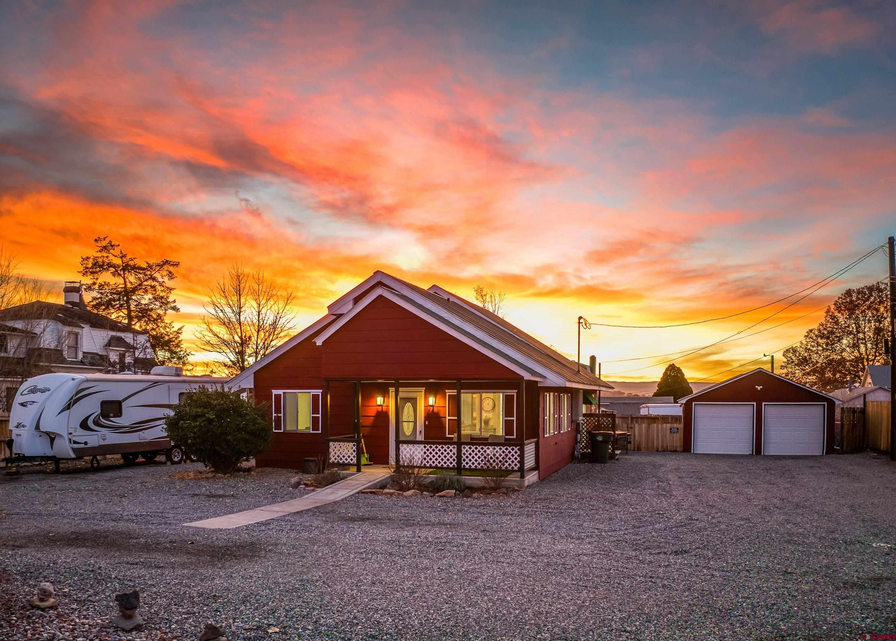 249 Park Street Delta, CO 81416 - Photo 19 of 22 a front view of a house with a yard