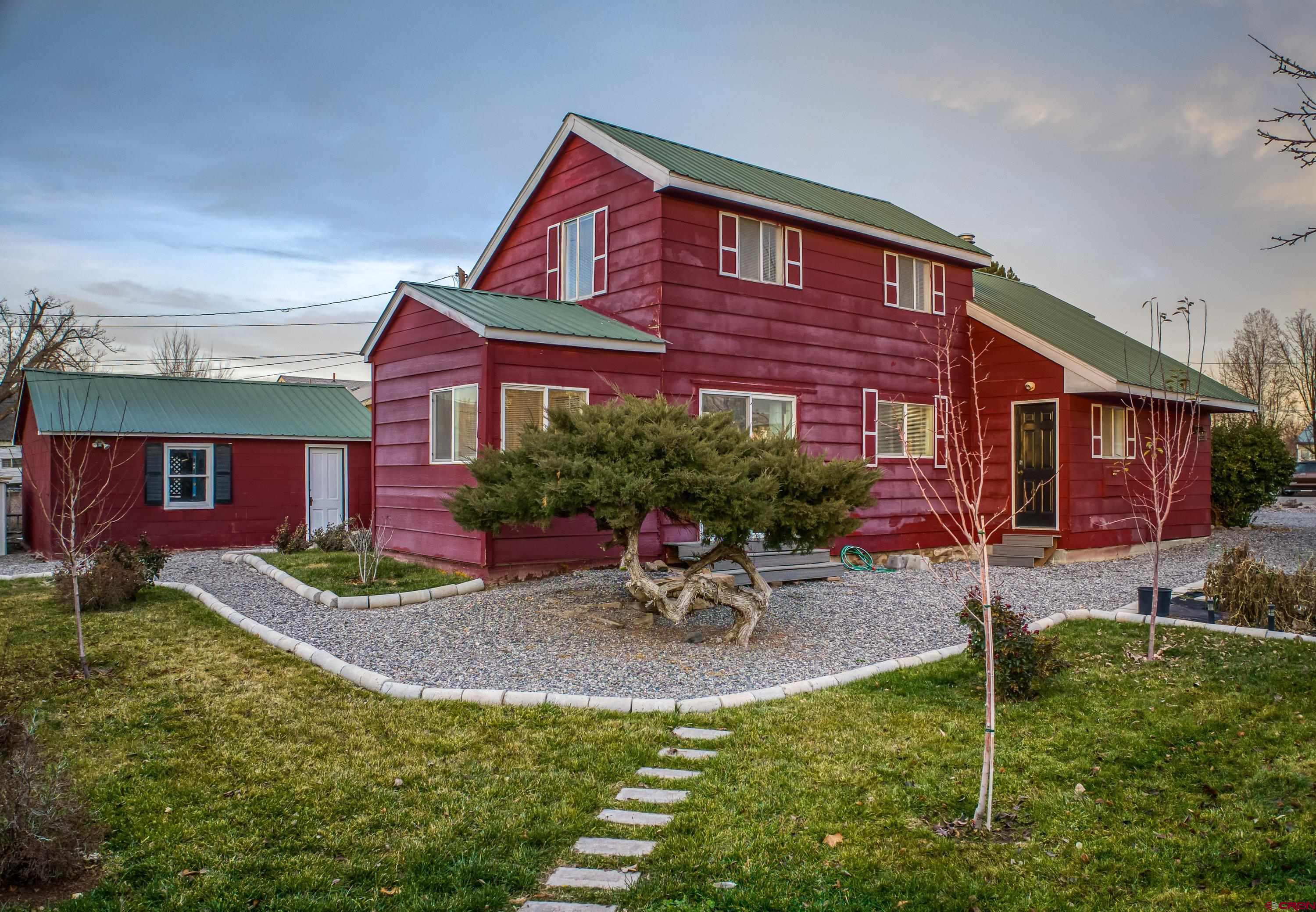 249 Park Street Delta, CO 81416 - Photo 20 of 22 a view of a house with a yard porch and sitting area