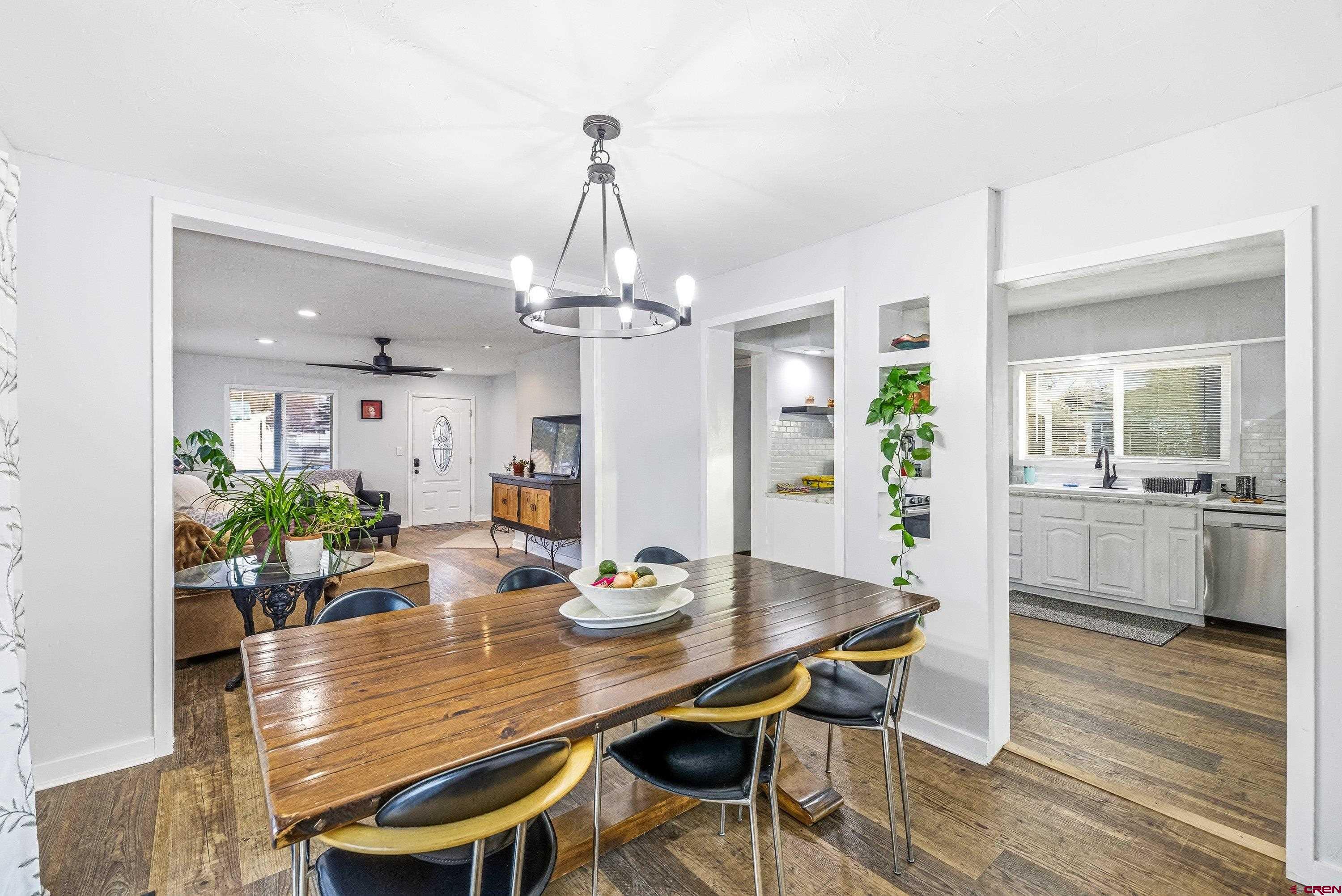249 Park Street Delta, CO 81416 - Photo 4 of 22 a view of a dining room with furniture wooden floor and chandelier