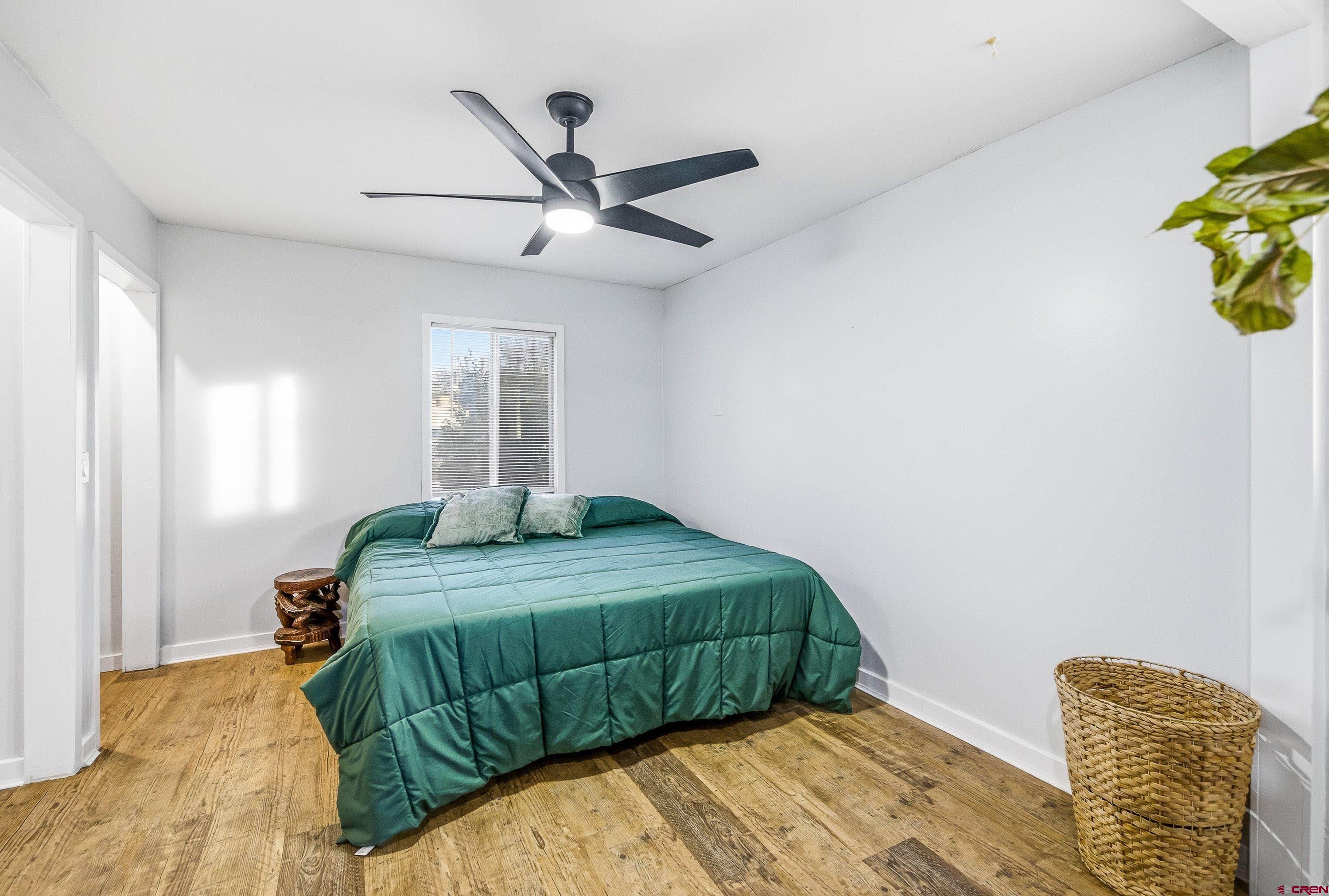 249 Park Street Delta, CO 81416 - Photo 6 of 22 a bedroom with a bed and a window