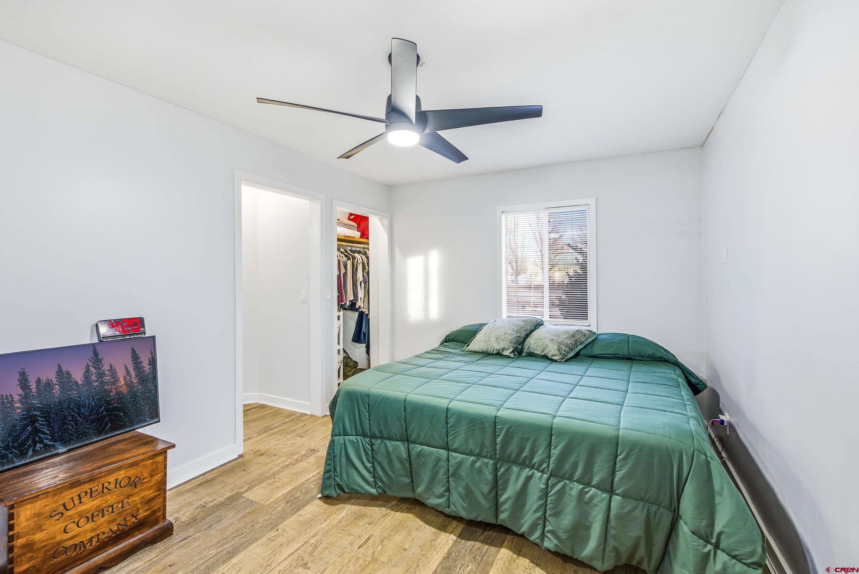 249 Park Street Delta, CO 81416 - Photo 7 of 22 a bedroom with a bed and a flat screen tv