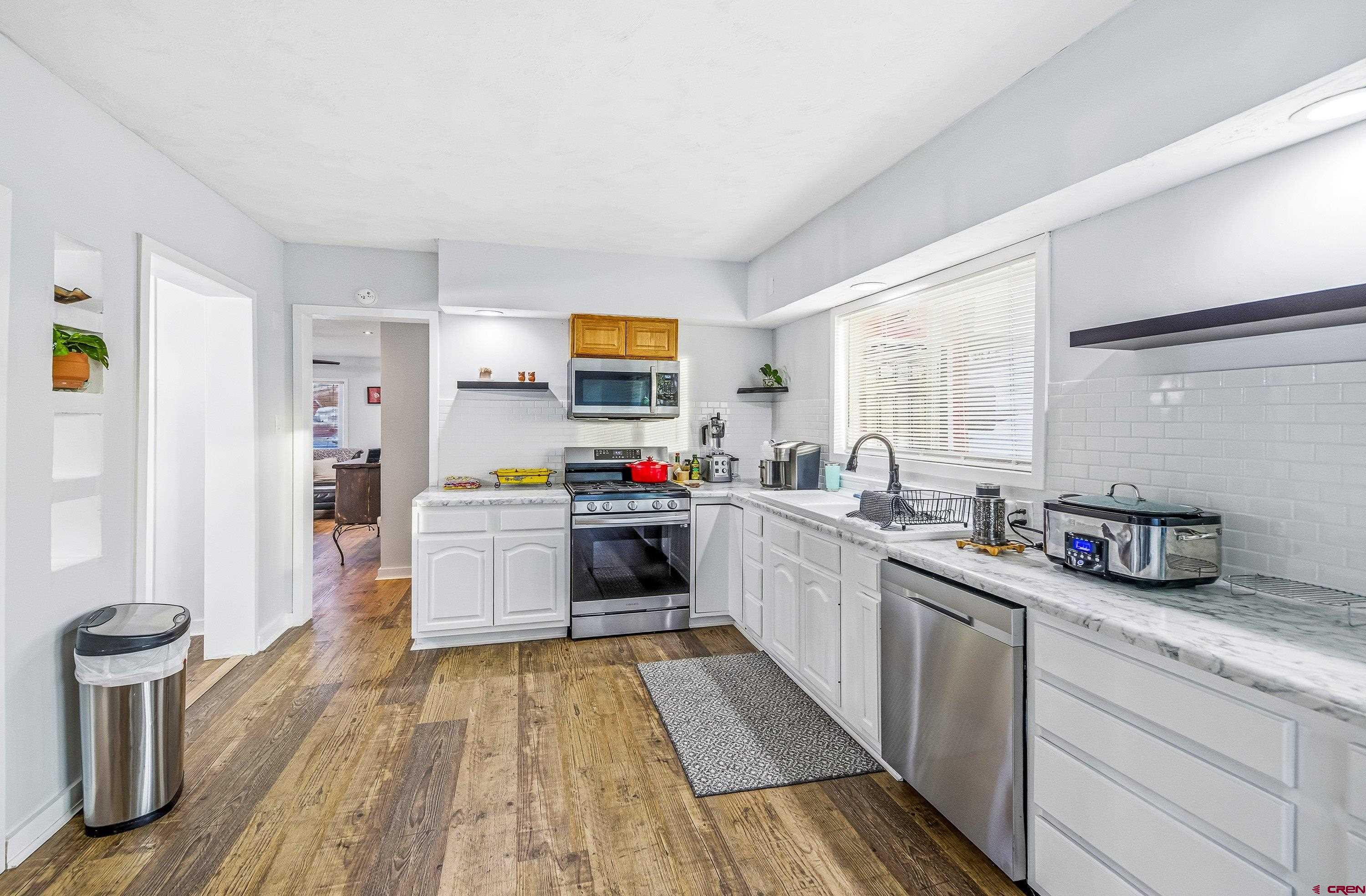 249 Park Street Delta, CO 81416 - Photo 10 of 22 a kitchen with a sink and a stove top oven