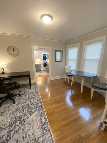 a living room with furniture and a rug