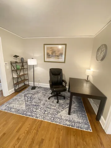 a living room with furniture and a rug