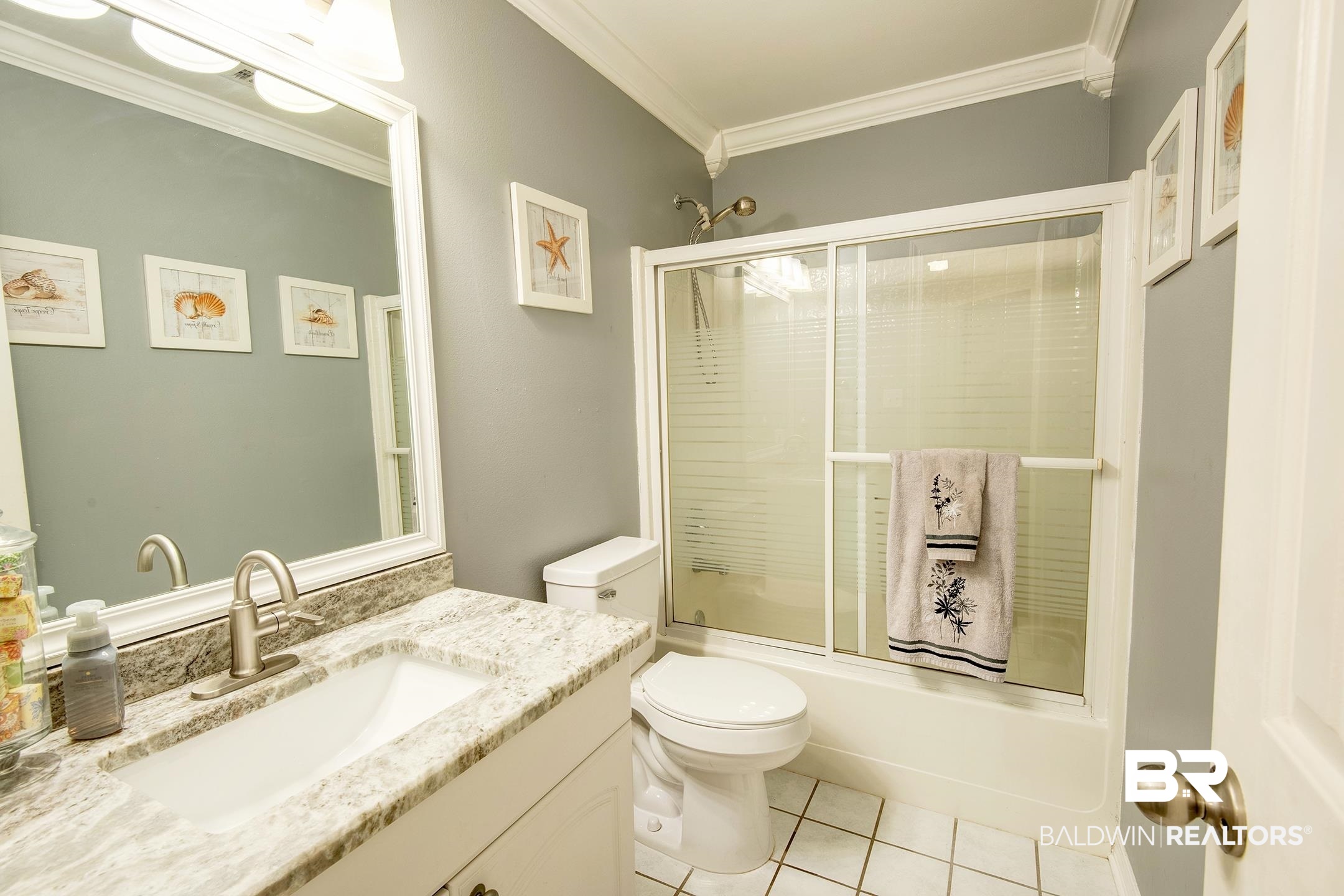 10093 Willis Road Foley, AL 36535 - Photo 15 of 33 Full bath with ornamental molding, vanity, combined bath / shower with glass door, and light tile patterned flooring