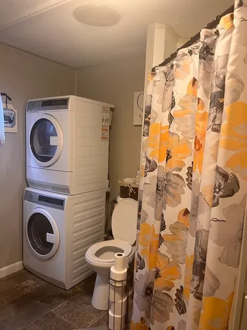 a bathroom with a toilet and a sink