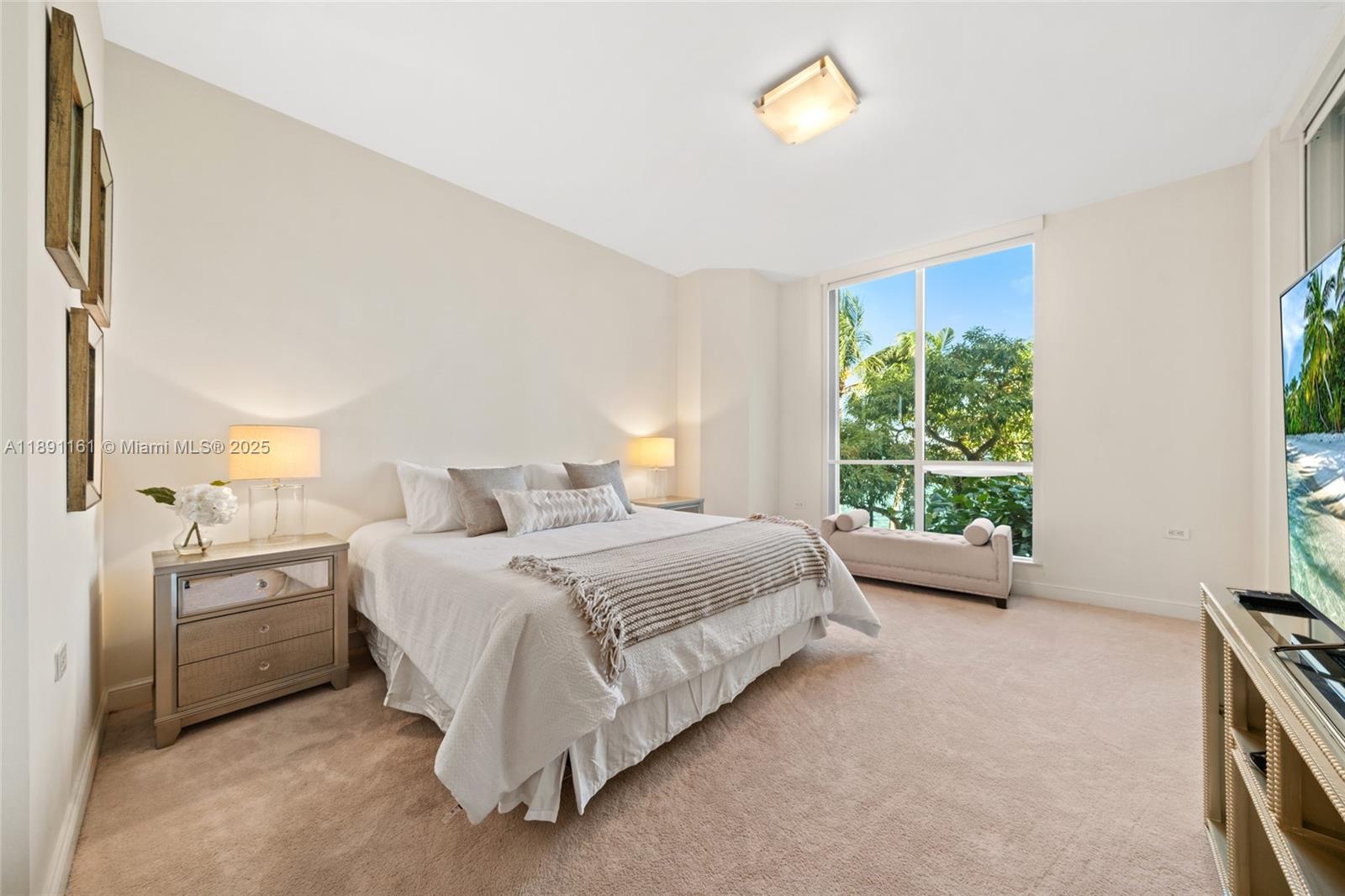 848 Brickell Key Drive, Unit 201 Miami, FL 33131 - Photo 11 of 31 a bed room with a bed and a couch