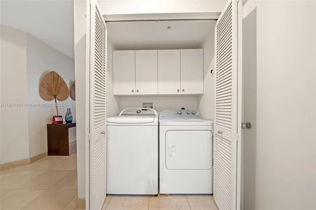 a view of storage and utility room with washer and dryer