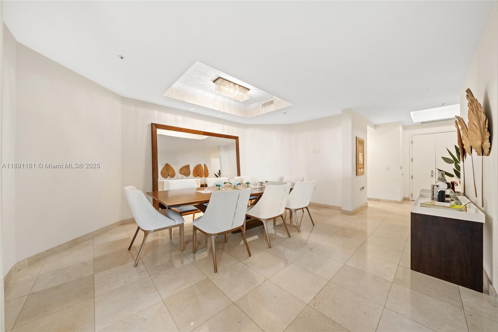 848 Brickell Key Drive, Unit 201 Miami, FL 33131 - Photo 8 of 31 a view of a dining room with furniture and a livingroom