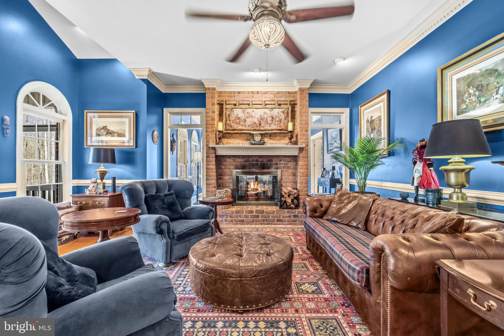 4514 Den Haag Road Warrenton, VA 20187 - Photo 12 of 56 a living room with furniture a fireplace and a chandelier
