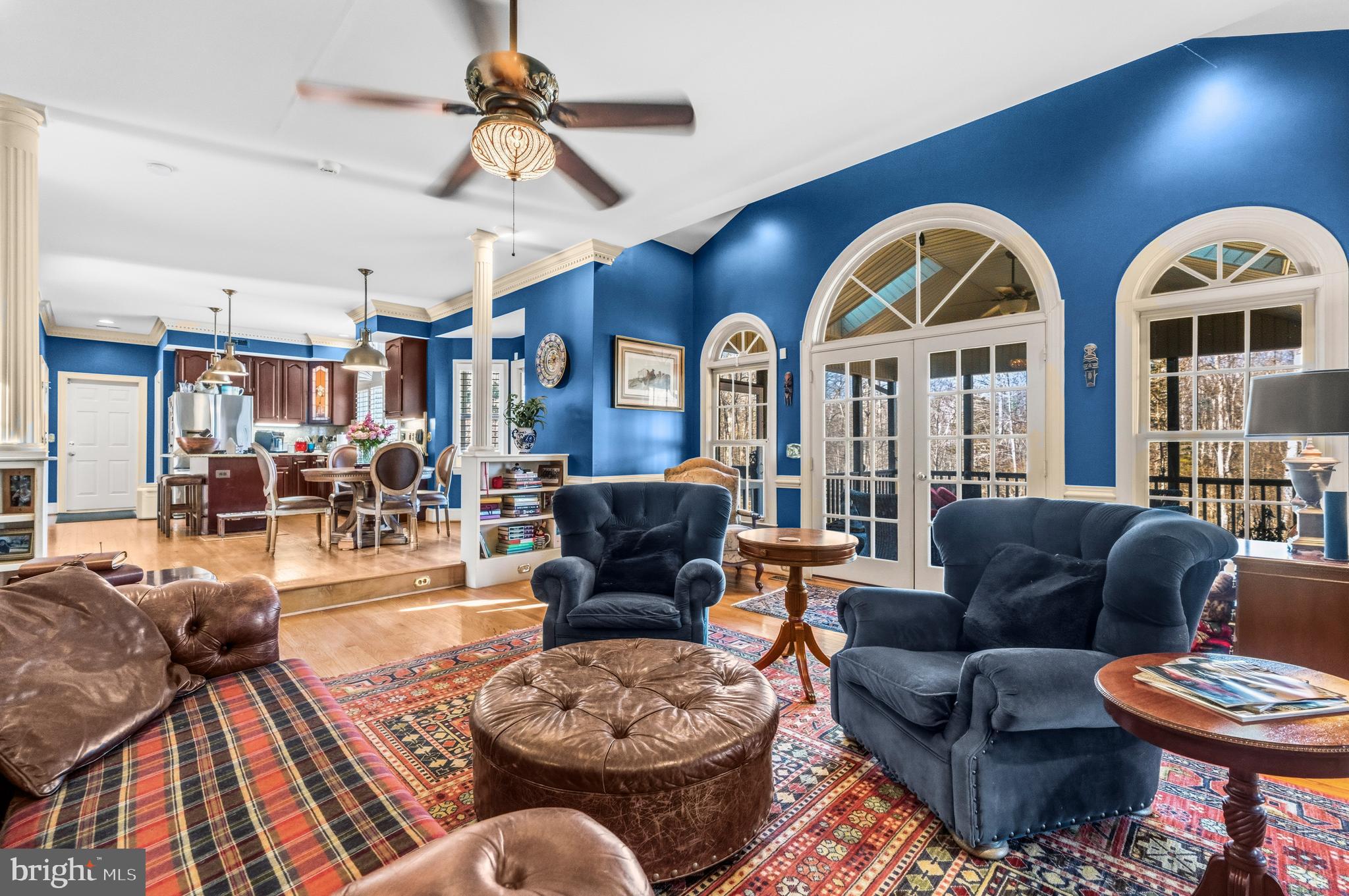 4514 Den Haag Road Warrenton, VA 20187 - Photo 13 of 56 a living room with furniture a rug and a chandelier