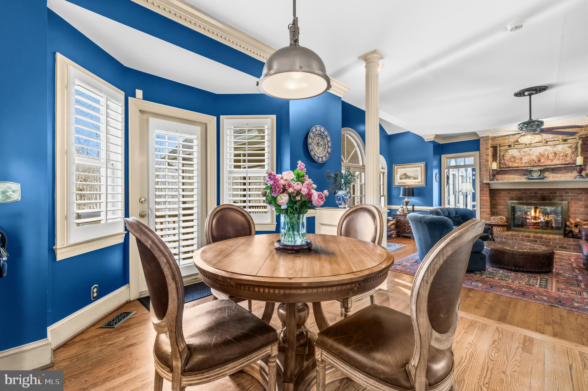 4514 Den Haag Road Warrenton, VA 20187 - Photo 15 of 56 a dining room with furniture a chandelier and wooden floor