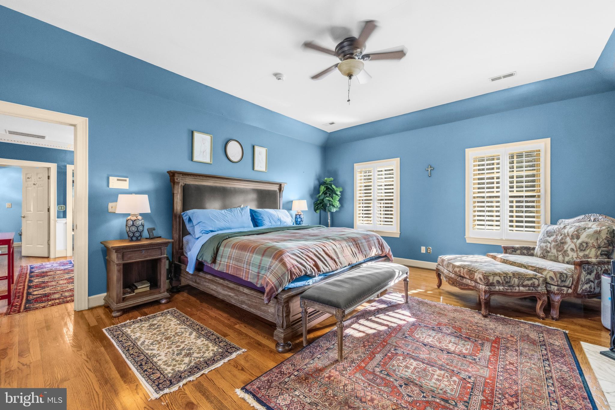 4514 Den Haag Road Warrenton, VA 20187 - Photo 23 of 56 a bedroom with a bed a couches and wooden floor