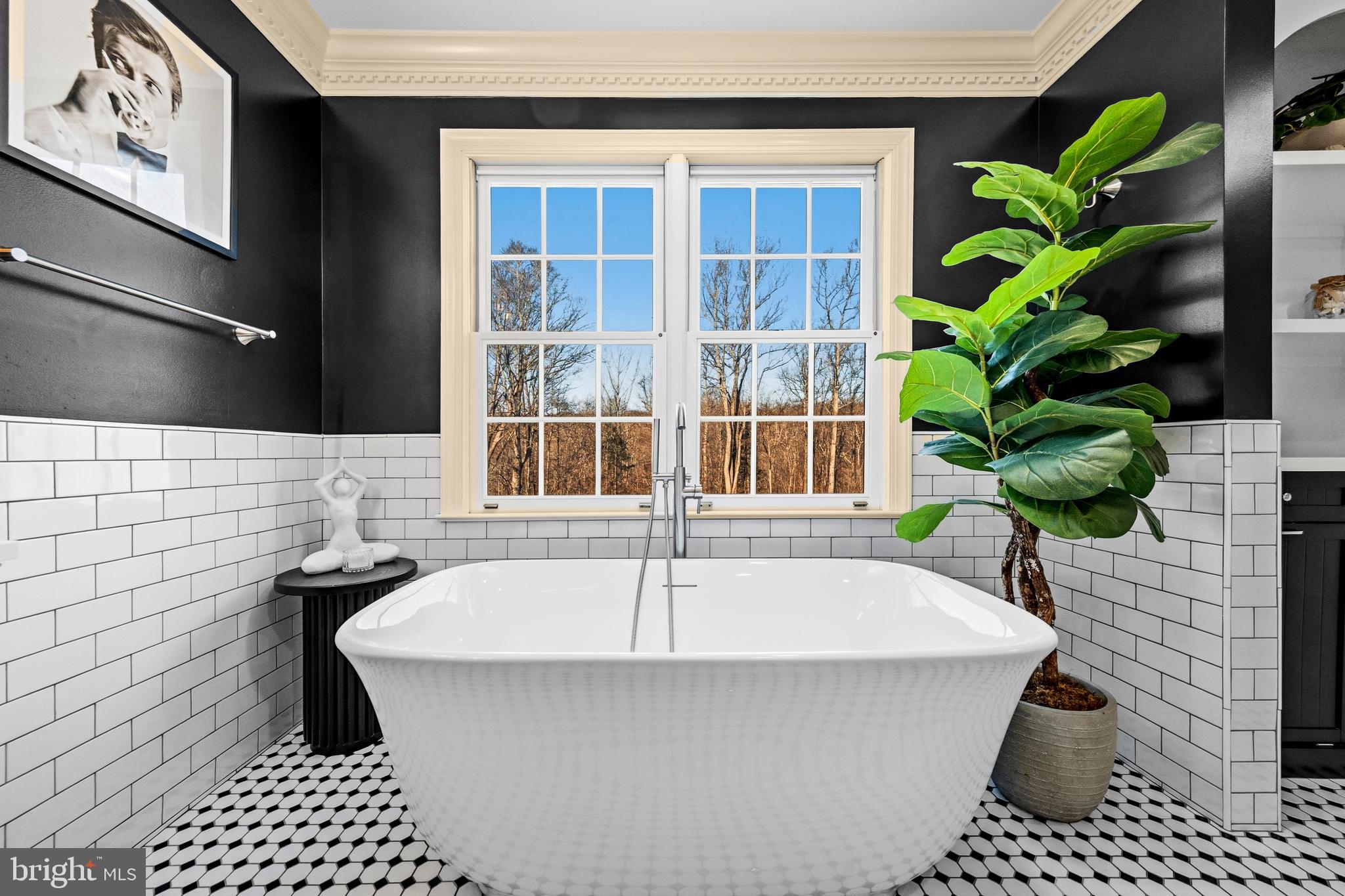 4514 Den Haag Road Warrenton, VA 20187 - Photo 27 of 56 a white bath tub sitting in front of a window