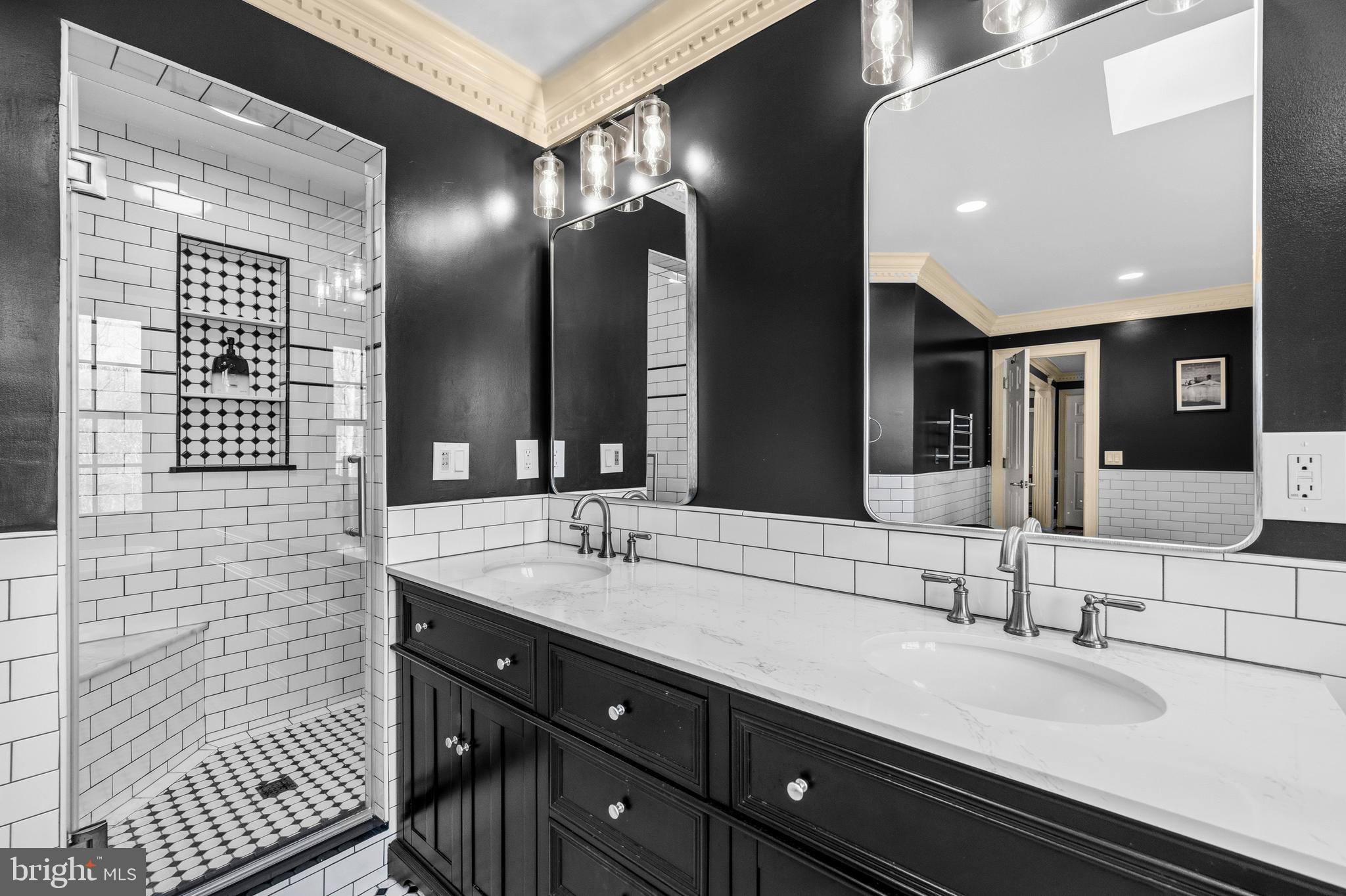 4514 Den Haag Road Warrenton, VA 20187 - Photo 28 of 56 a bathroom with a double vanity sink and a mirror