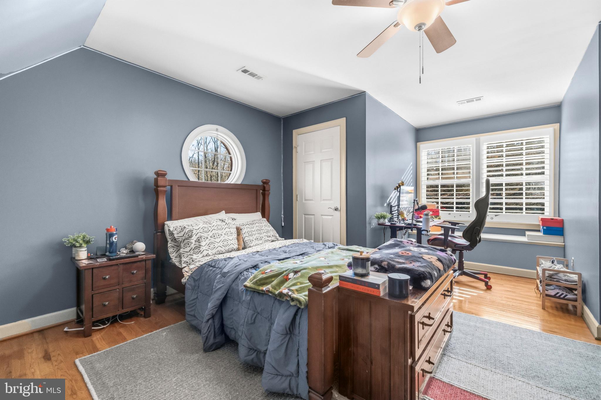4514 Den Haag Road Warrenton, VA 20187 - Photo 33 of 56 a bed room with a bed and a chandelier