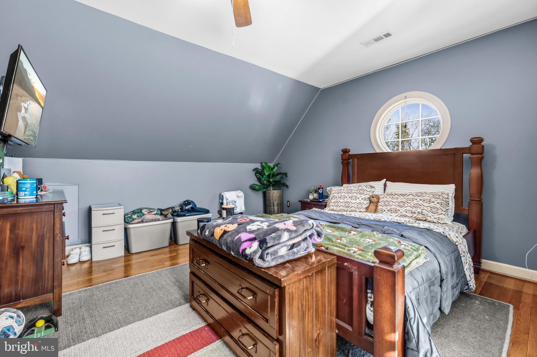 4514 Den Haag Road Warrenton, VA 20187 - Photo 34 of 56 a bedroom with a bed and wooden floor