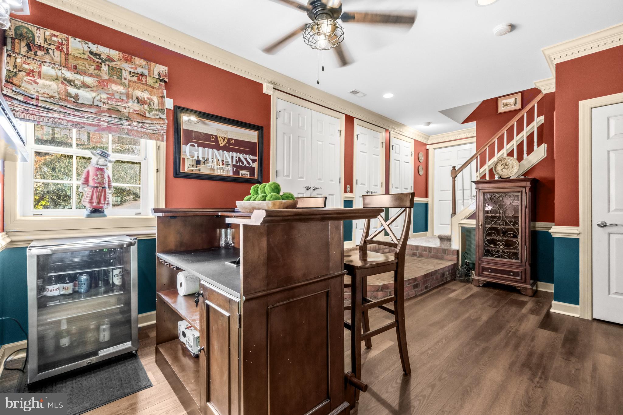 4514 Den Haag Road Warrenton, VA 20187 - Photo 37 of 56 a open kitchen with stainless steel appliances granite countertop a stove top oven a dining table and chairs with wooden floor