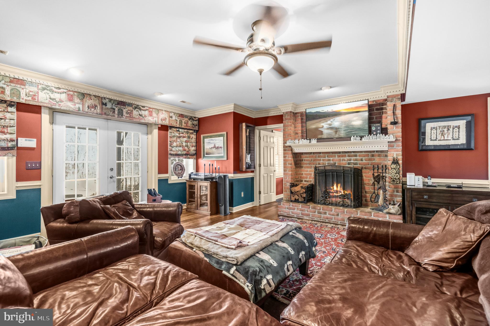 4514 Den Haag Road Warrenton, VA 20187 - Photo 40 of 56 a bedroom with furniture and a fireplace