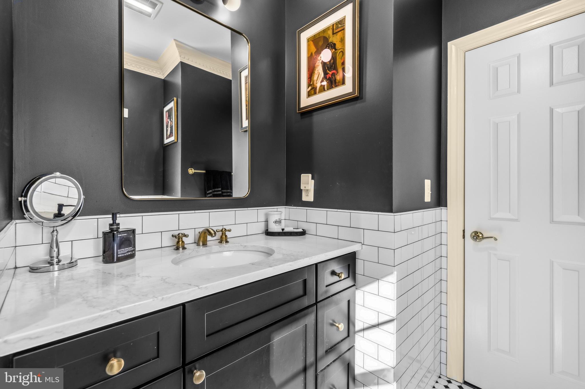 4514 Den Haag Road Warrenton, VA 20187 - Photo 43 of 56 a bathroom with a sink and a mirror