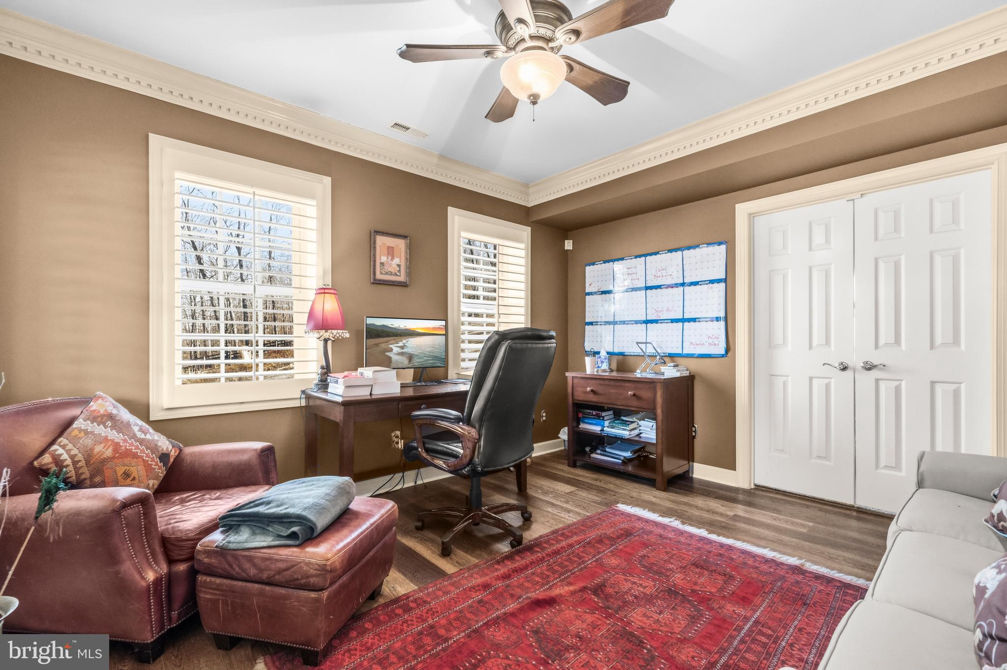 4514 Den Haag Road Warrenton, VA 20187 - Photo 46 of 67 a living room with furniture a fireplace and a window