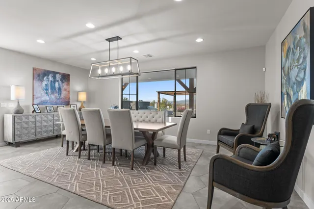 a view of a dining room with furniture window and chandelier