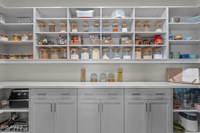 a view of kitchen with cabinets