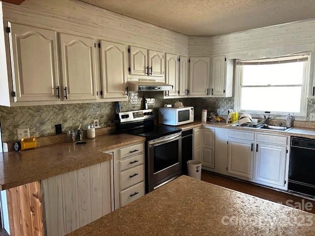 320 Luckadoo Road Bostic, NC 28018 - Photo 15 of 24 a kitchen with granite countertop a sink stainless steel appliances and cabinets