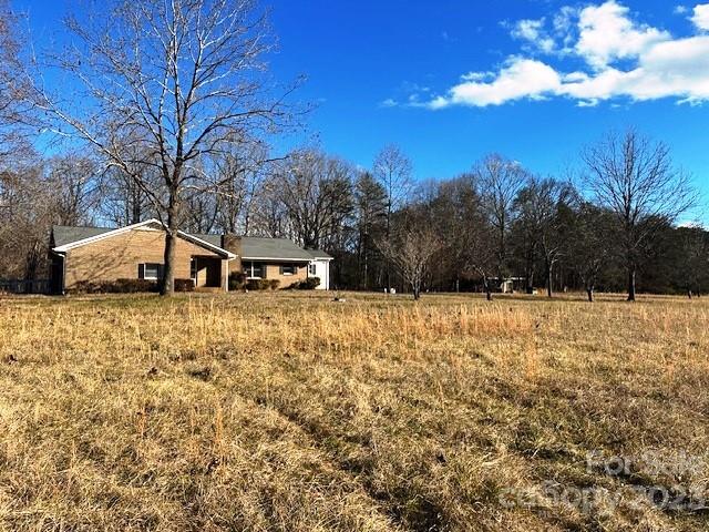 320 Luckadoo Road Bostic, NC 28018 - Photo 2 of 24 a view of house with a yard