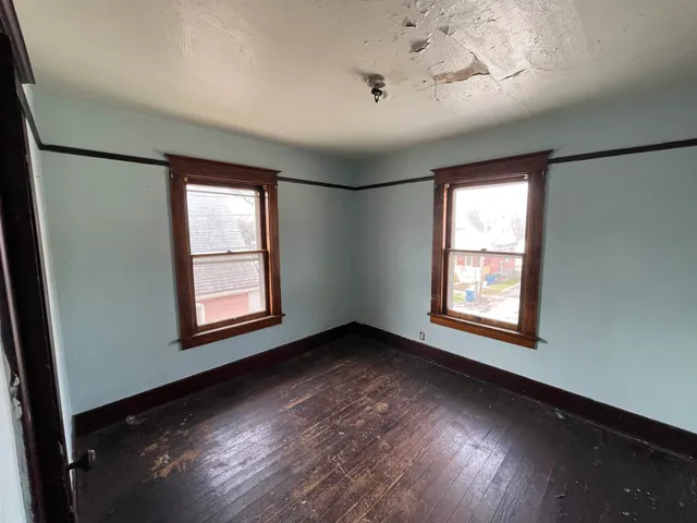 a bathroom with a sink mirror vanity and toilet