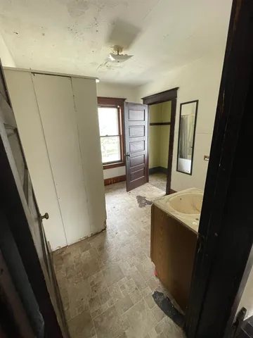 a view of staircase with wooden floor and window