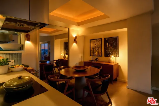 a kitchen with a table and chairs in it