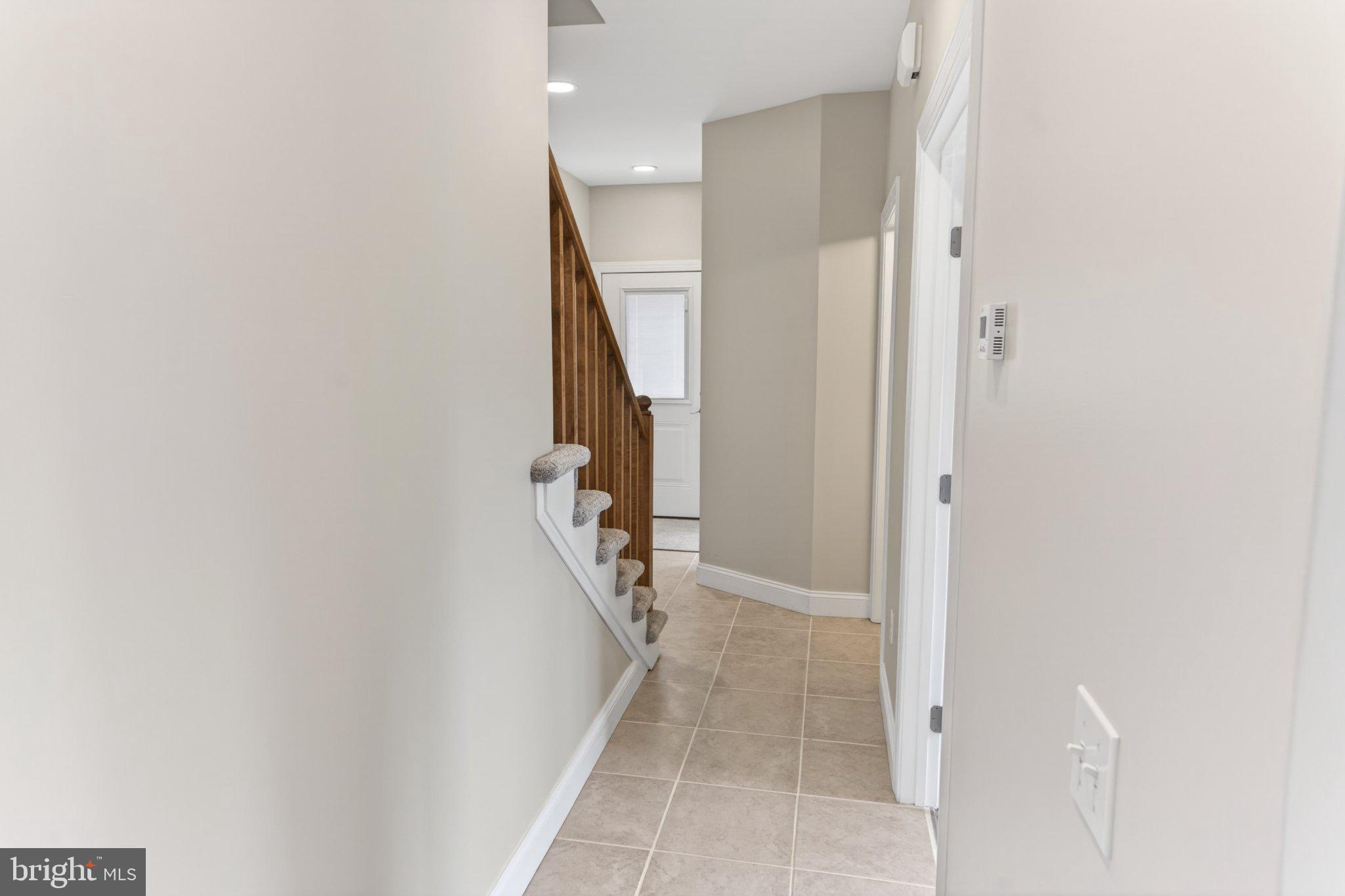 34029 Peppers Corner Road Millville, DE 19967 - Photo 35 of 101 Inviting entryway with staircase charm.