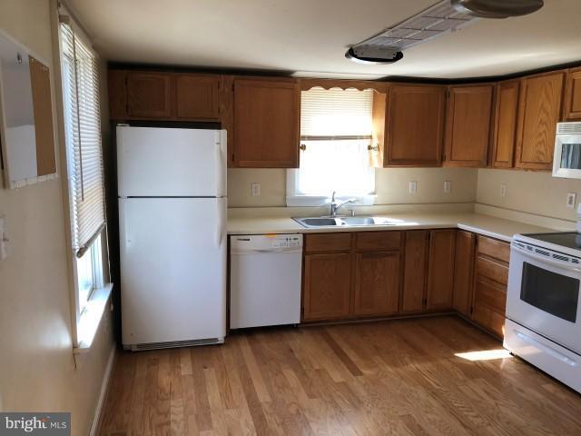 25250 Sotterley Road Hollywood, MD 20636 - Photo 11 of 20 a kitchen with a sink appliances and cabinets