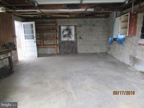 25250 Sotterley Road Hollywood, MD 20636 - Photo 4 of 20 a view of an empty room with a fireplace