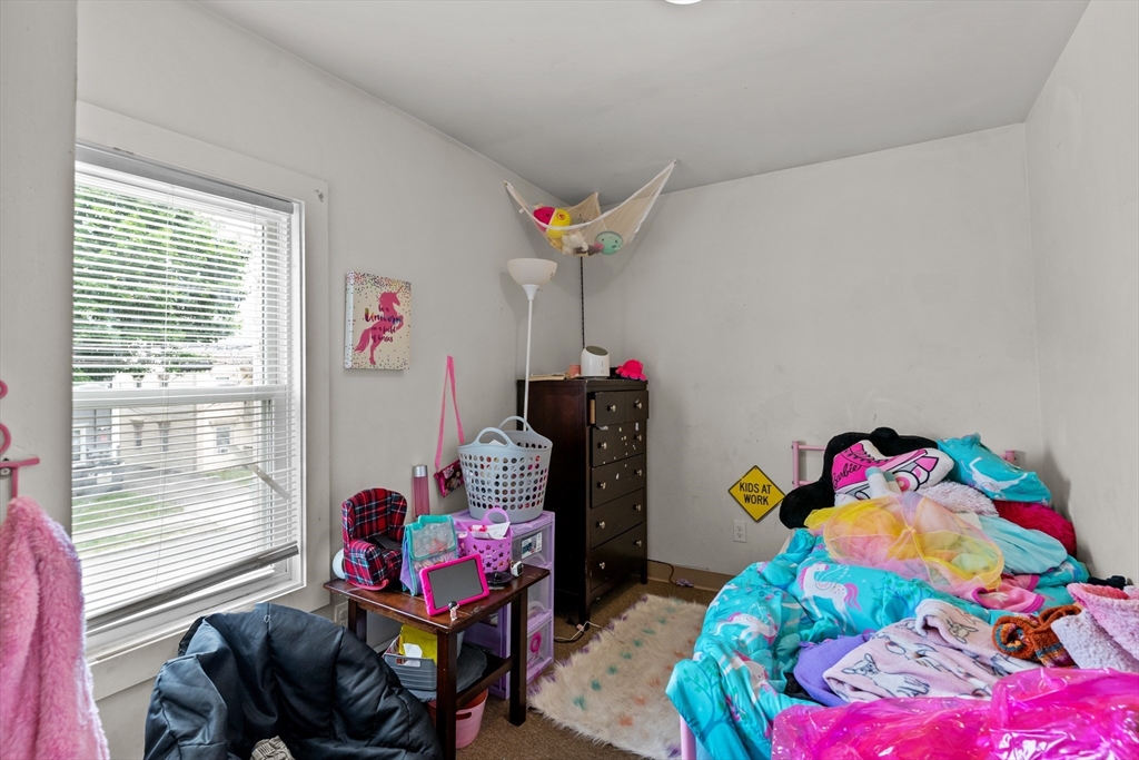 126 Earle Street Woonsocket, RI 02895 - Photo 13 of 42 a bedroom with furniture and a bed