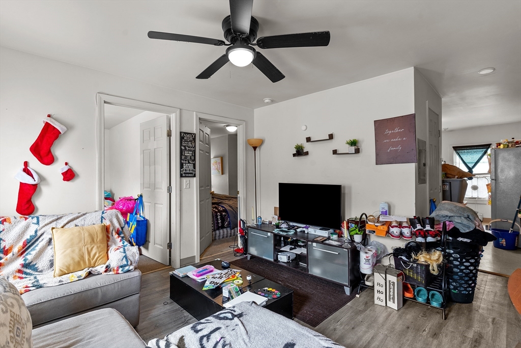 126 Earle Street Woonsocket, RI 02895 - Photo 14 of 42 a living room with furniture and a flat screen tv