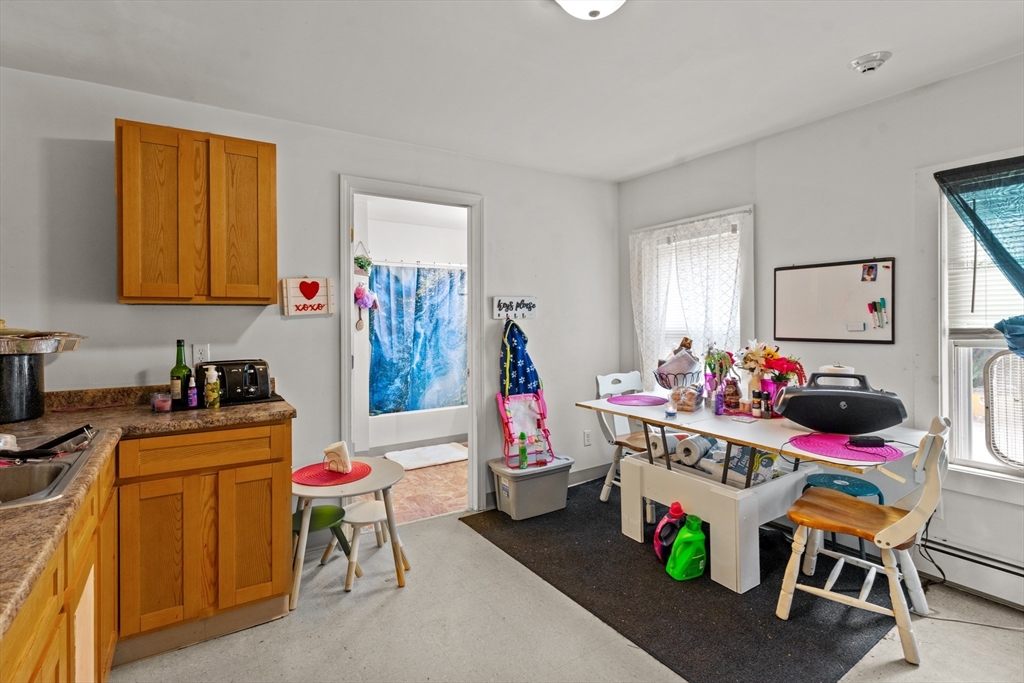 126 Earle Street Woonsocket, RI 02895 - Photo 15 of 42 a room with furniture a rug toys and a window
